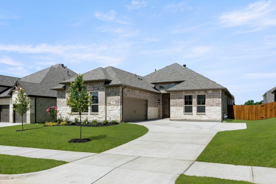 Front exterior of a new home in Sheppard's Place, Waxahachie, TX, highlighting curb appeal (Image 19). Front exterior of a new home in Sheppard's Place, Waxahachie, TX, highlighting curb appeal (Image 19).