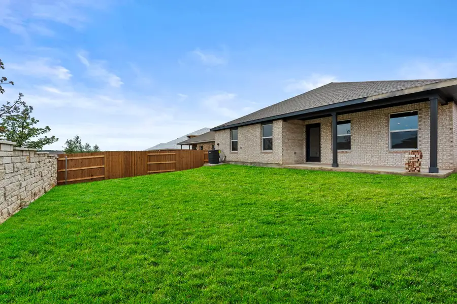 Exterior details and patio area of a home in Bar W Ranch, Leander (Image 4).