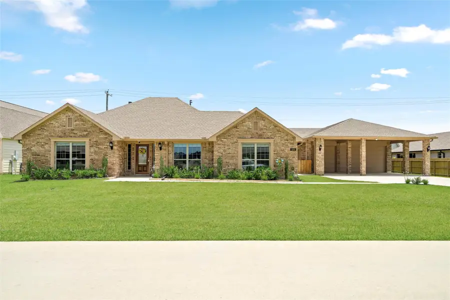 The classic brick home features a manicured lawn and a welcoming covered entry — offering excellent curb appeal on a generous lot. The classic brick home features a manicured lawn and a welcoming covered entry — offering excellent curb appeal on a generous lot.
