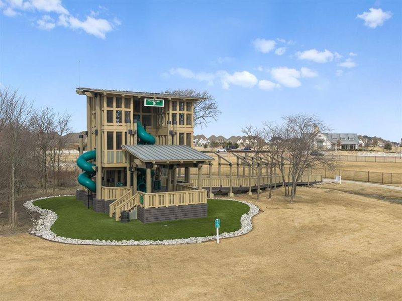 Back of playground featuring a residential view