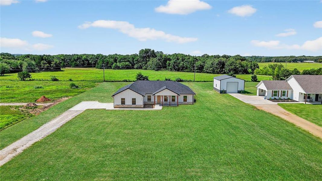 Front exterior of a new home in , Sadler, TX, highlighting curb appeal (Image 27). Front exterior of a new home in , Sadler, TX, highlighting curb appeal (Image 27).