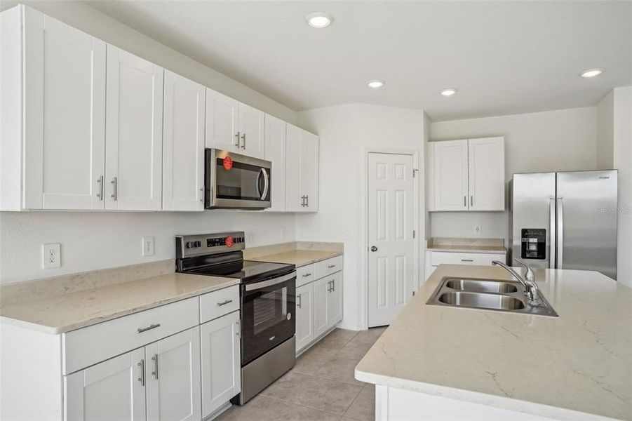 Furnished interior view inside a new home in Lake Deer Estates - Signature Series, Poinciana (Image 11). Furnished interior view inside a new home in Lake Deer Estates - Signature Series, Poinciana (Image 11).