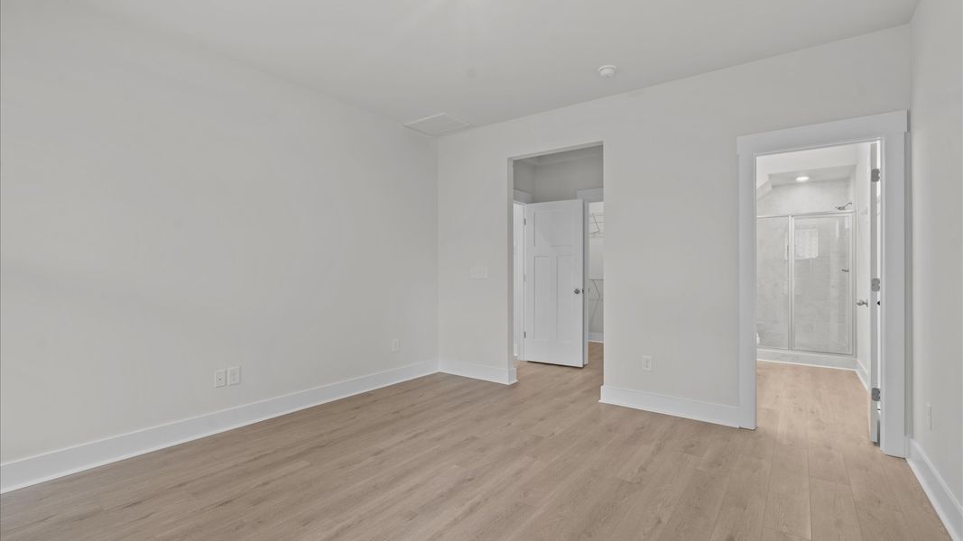 Large windows in spacious primary suite in two story townhome at Aspen Ridge by DRB Homes in Lyman, SC Large windows in spacious primary suite in two story townhome at Aspen Ridge by DRB Homes in Lyman, SC