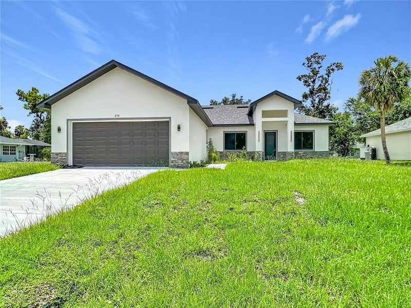 Front exterior of a new home in , Port Charlotte, FL, highlighting curb appeal (Image 1). Front exterior of a new home in , Port Charlotte, FL, highlighting curb appeal (Image 1).