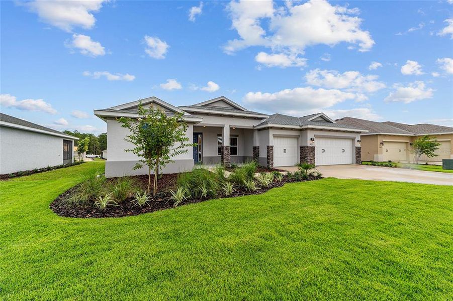 Front exterior of a new home in On Top of the World Communities, Ocala, FL, highlighting curb appeal (Image 20). Front exterior of a new home in On Top of the World Communities, Ocala, FL, highlighting curb appeal (Image 20).