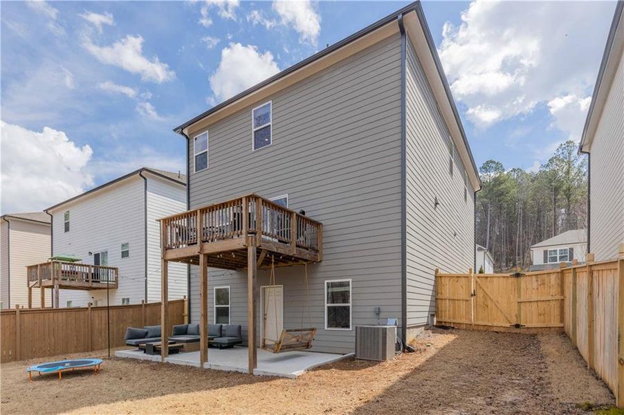 Exterior details and patio area of a home in Creekside at Farmers Crossing, Ball Ground (Image 27).
