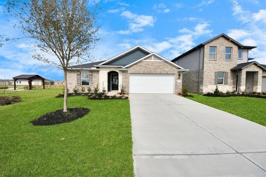 Front exterior of a new home in Sweetgrass Village, Crosby, TX, highlighting curb appeal (Image 1).