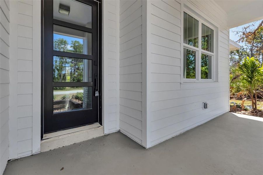 Front exterior of a new home in , Port Charlotte, FL, highlighting curb appeal (Image 23).