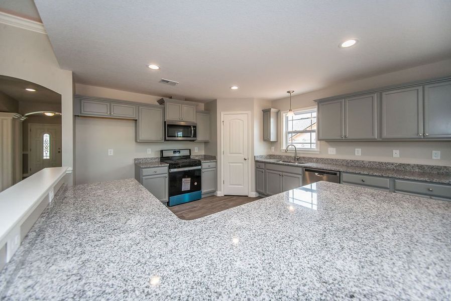 Representative furnished interior of a home built from the Beaumont by Enchanted Homes in Guadalupe Heights, Seguin (Image 15).
