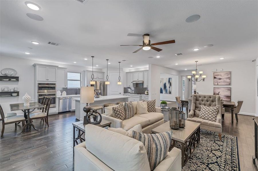 Representative Photo. This view of the Driftwood family room and kitchen boasts the openness of the plan