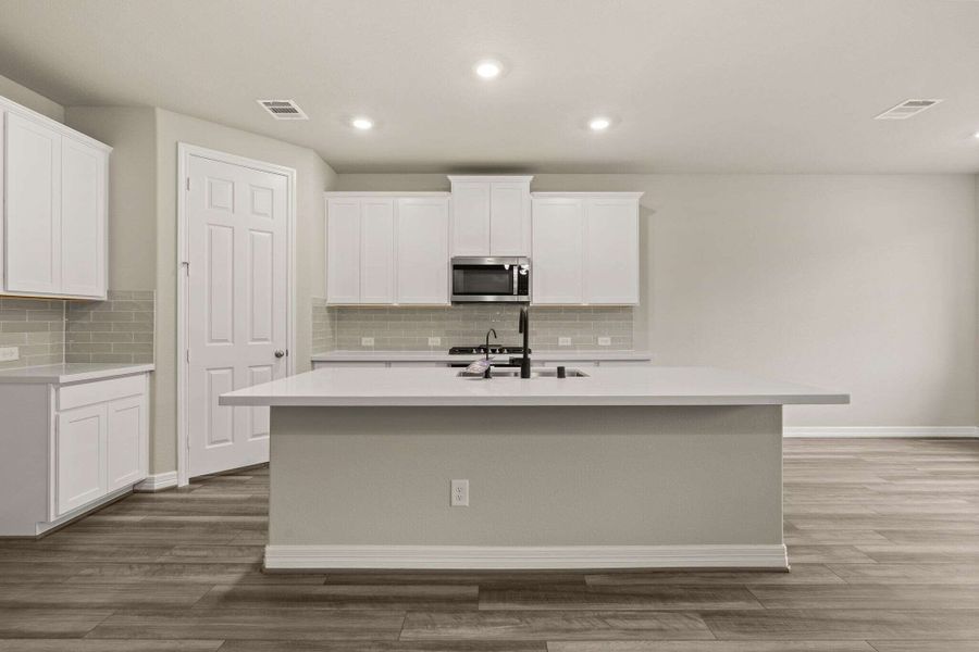 Kitchen. Note: Sample product photo - actual exterior and interior selections may vary by homesite