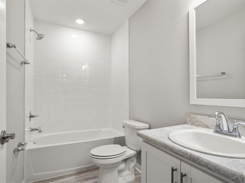 Secondary bedrooms share a convenient hall bath.
