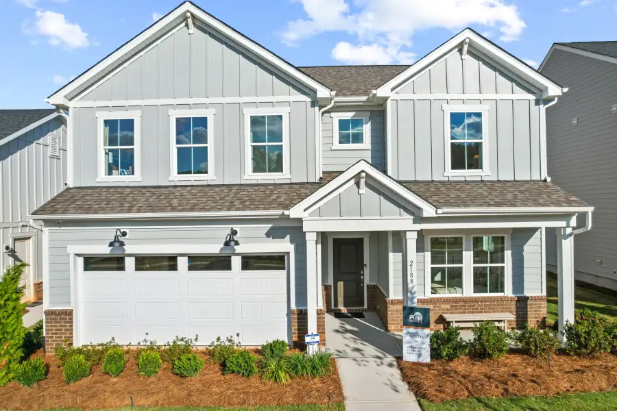 Front exterior of a new home in The Retreat at Carolina Ridge, Harrisburg, NC, highlighting curb appeal (Image 26). Front exterior of a new home in The Retreat at Carolina Ridge, Harrisburg, NC, highlighting curb appeal (Image 26).