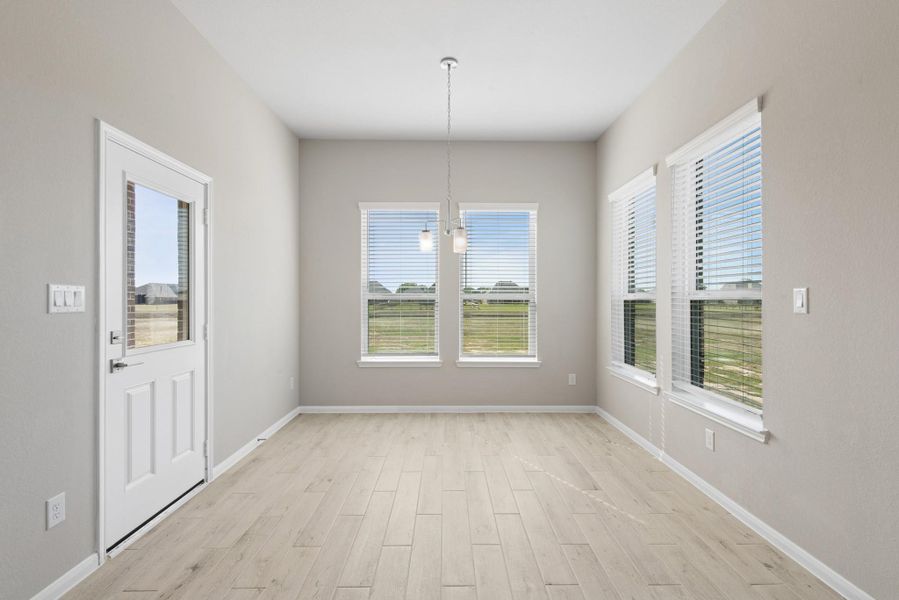 Sun-lit dining area Sun-lit dining area