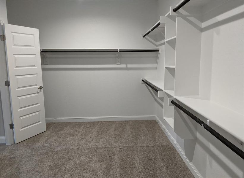 Large walk-in Closet opening to Laundry Room