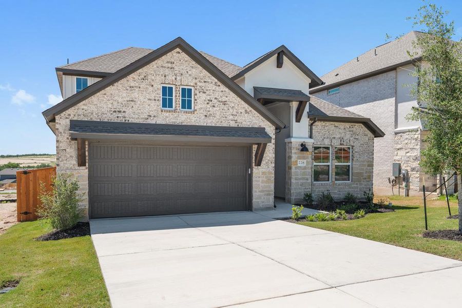 Front exterior of a new home in Park Collection at Lariat, Liberty Hill, TX, highlighting curb appeal (Image 24). Front exterior of a new home in Park Collection at Lariat, Liberty Hill, TX, highlighting curb appeal (Image 24).