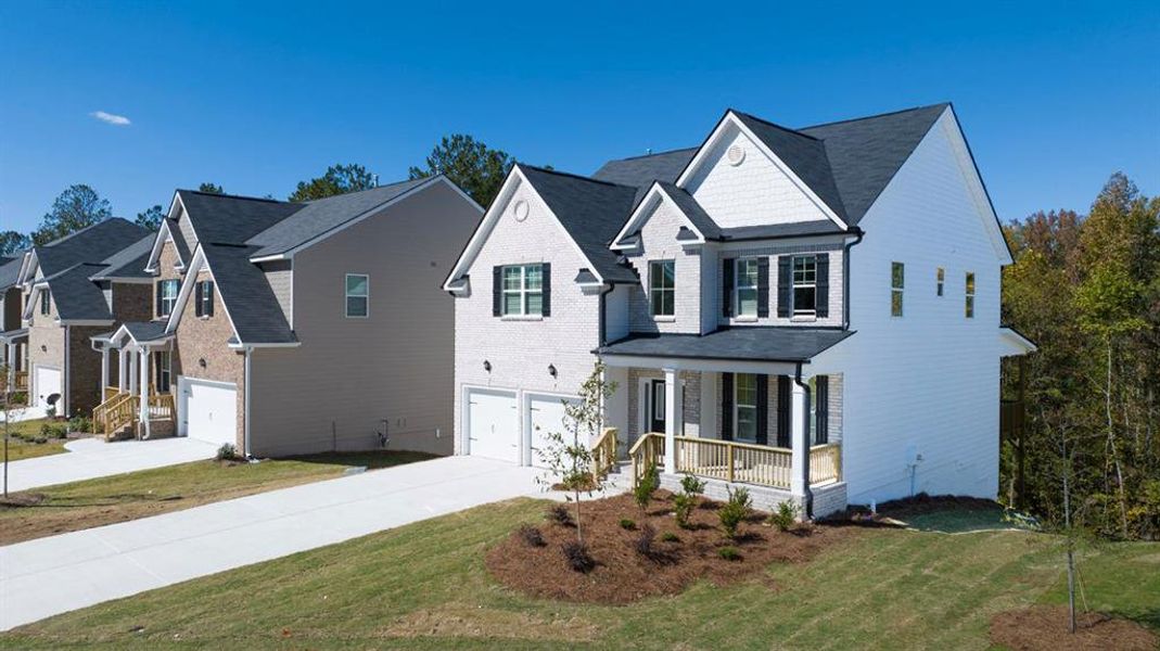 Front exterior of a new home in Water Oak Estates, Lawrenceville, GA, highlighting curb appeal (Image 16).