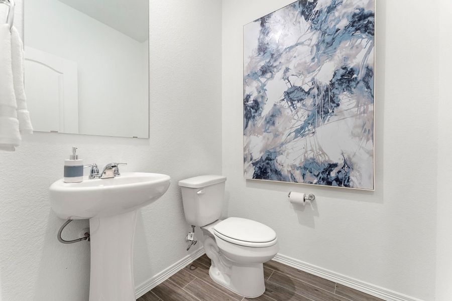 A bathroom with a large map on the wall. A bathroom with a large map on the wall.