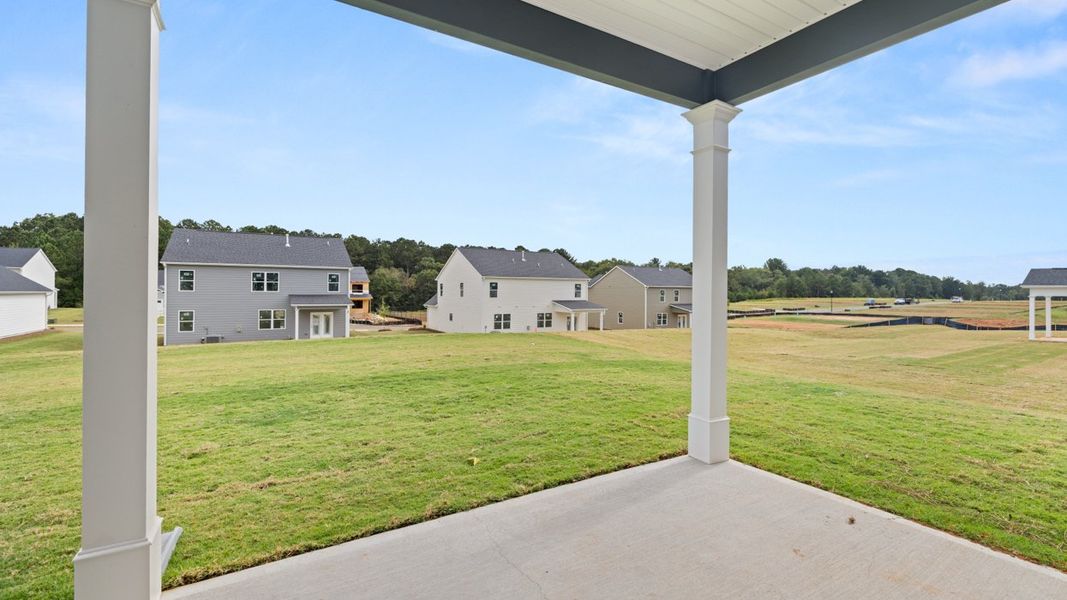 Exterior details and patio area of a home in Preserve at Dove Creek, Statham (Image 3).