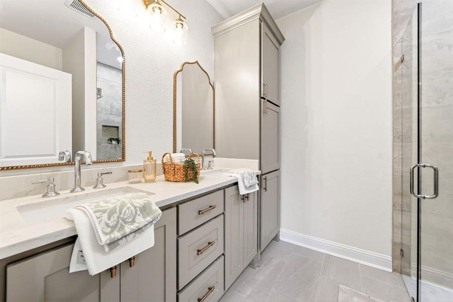 Dual vanity with undermount sinks, light countertop, and chrome fixtures