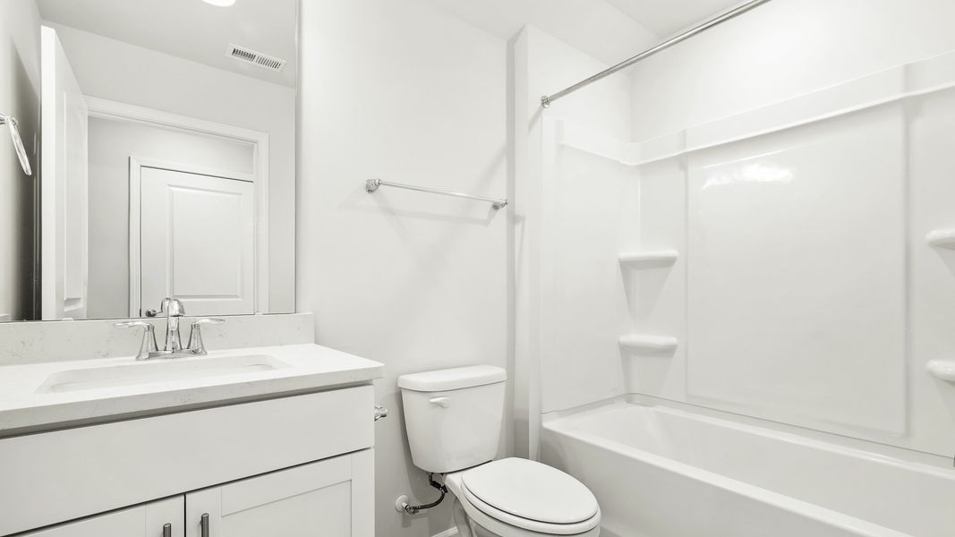 Furnished interior view inside a new home in The Villas at Kinsley, Jamestown (Image 13).