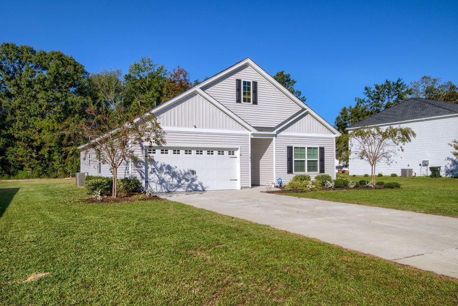 Front exterior of a new home in , Bonneau, SC, highlighting curb appeal (Image 1).