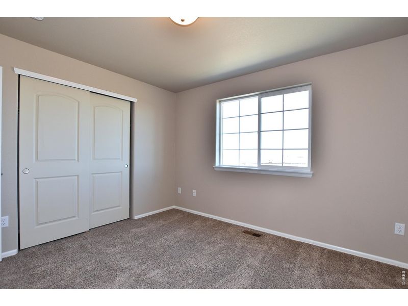 Spacious, unfurnished interior of a new home in Union Colony West, Greeley (Image 32).