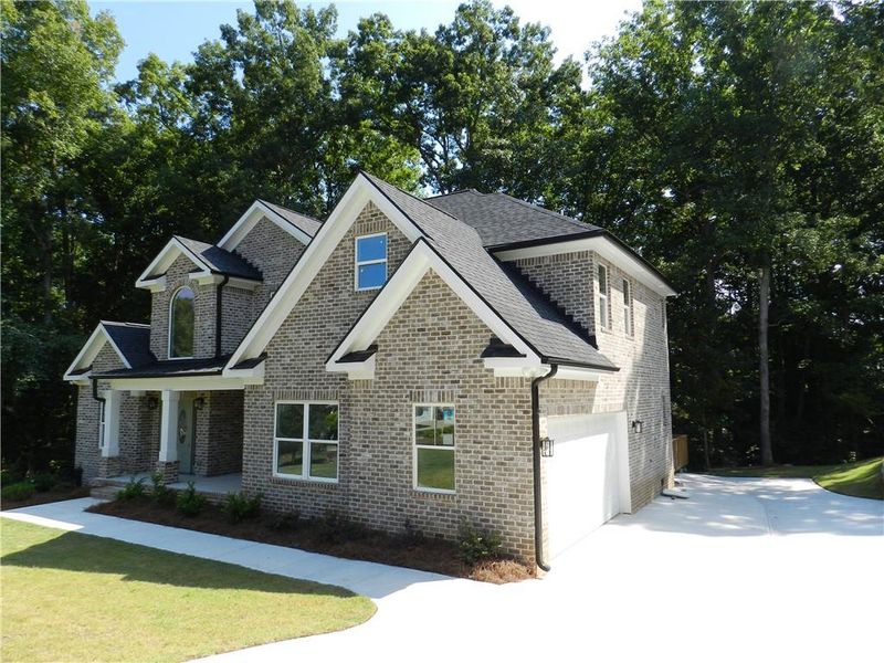 Front exterior of a new home in , McDonough, GA, highlighting curb appeal (Image 20).