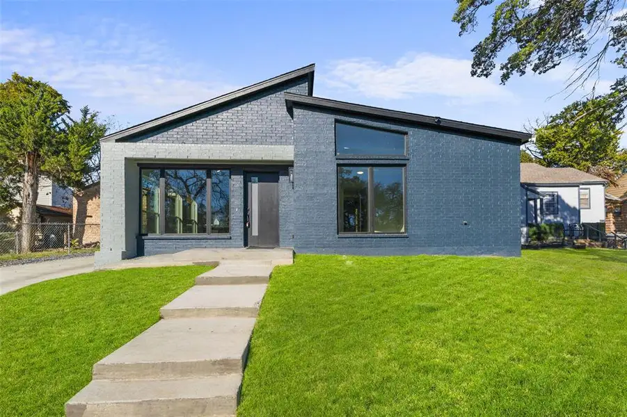 Back of property with brick siding