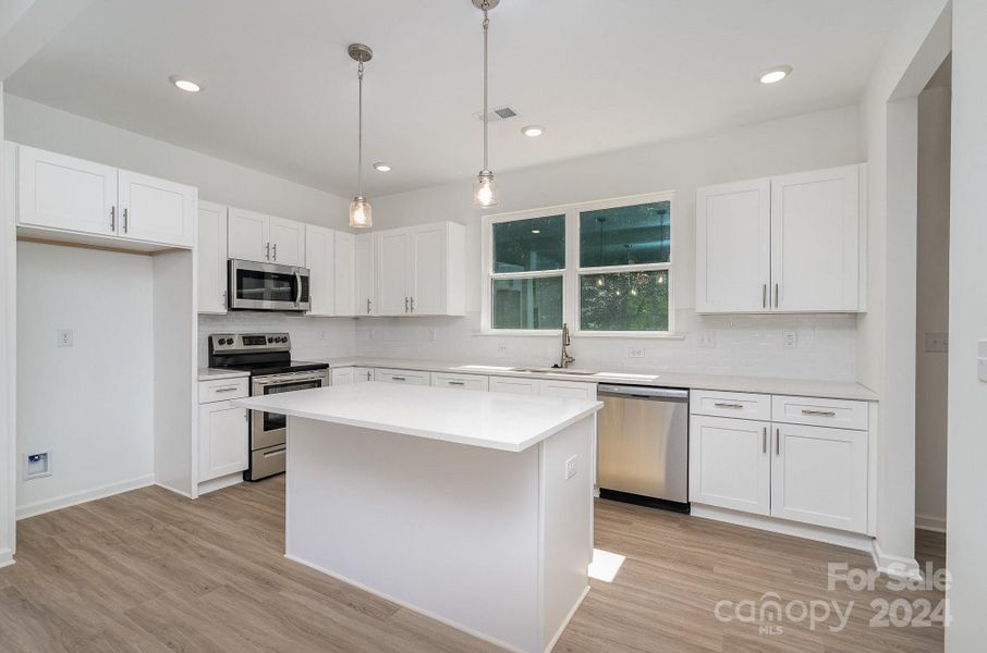 Representative Photo. White shaker cabinetry with dovetail and soft-close