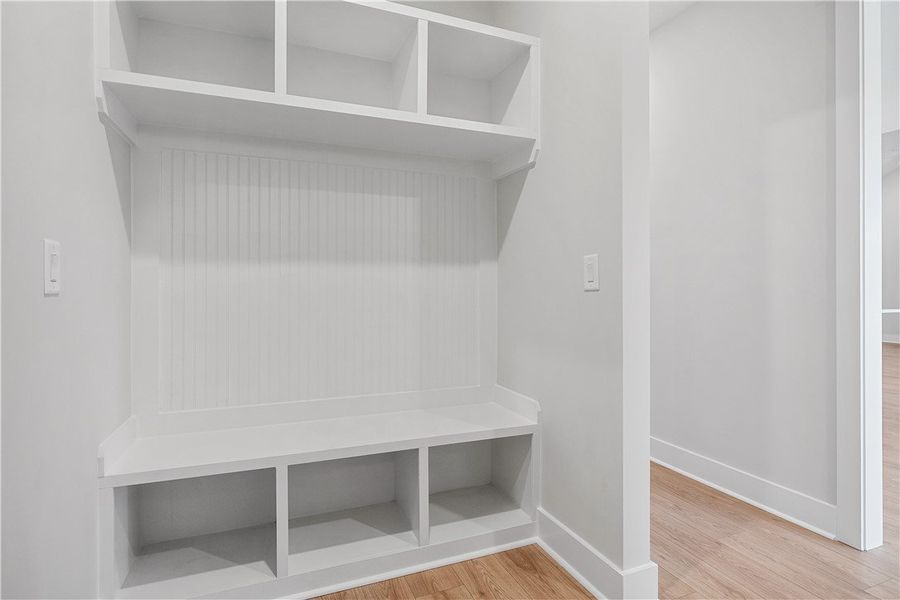 A well-designed mudroom with built-in storage solu A well-designed mudroom with built-in storage solu