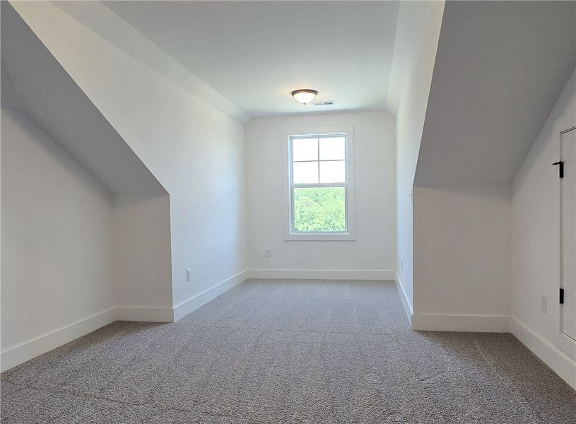 Sloped ceilings define this versatile 4th bedroom,