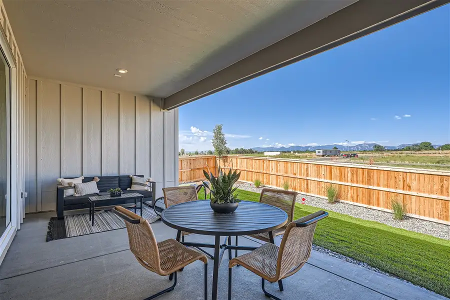 A patio with a table and chairs. A patio with a table and chairs.