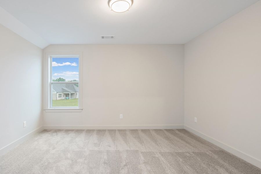 Neutral-toned room featuring a single window, light gray carpet, white baseboards, and a flush-mount ceiling light Neutral-toned room featuring a single window, light gray carpet, white baseboards, and a flush-mount ceiling light