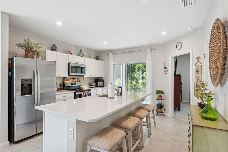 Kitchen with Stainless Steel Appliances and Builder Upgrade of Quartz Countertops