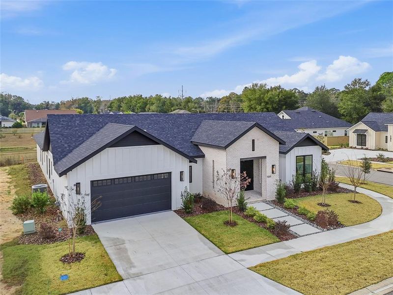 Front exterior of a new home in , Gainesville, FL, highlighting curb appeal (Image 23).