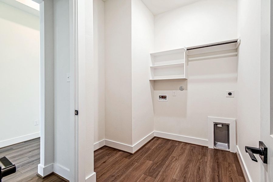 The utility room includes built-in storage and a dedicated laundry area for added everyday convenience The utility room includes built-in storage and a dedicated laundry area for added everyday convenience