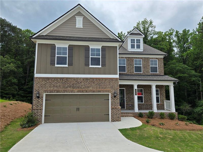 Front exterior of a new home in Enclave at Logan Point, Loganville, GA, highlighting curb appeal (Image 2).