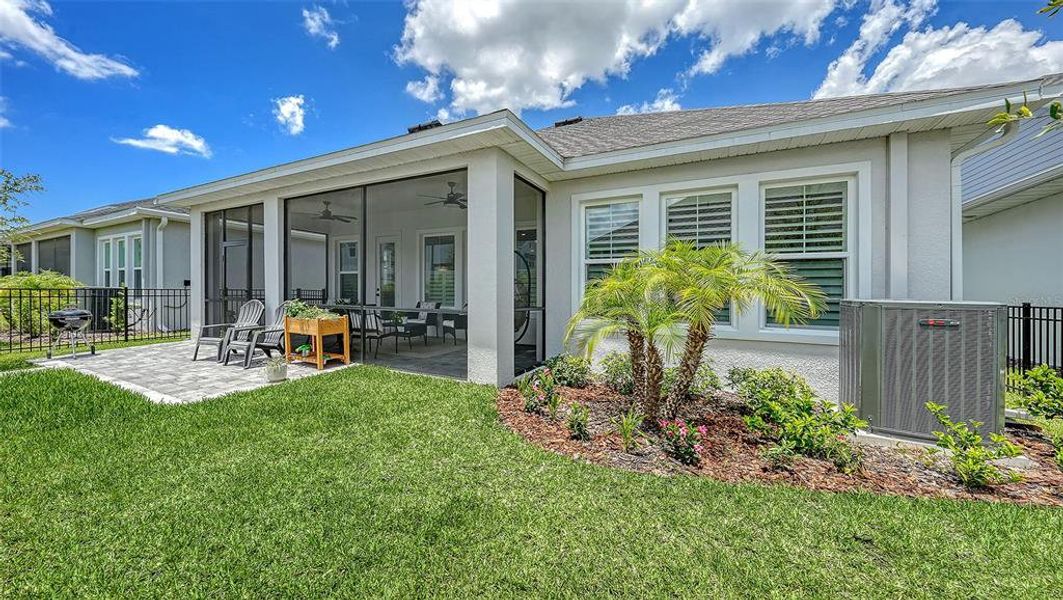 Exterior details and patio area of a home in Emerald Landing at Waterside at Lakewood Ranch – Lake Series, Sarasota (Image 24).