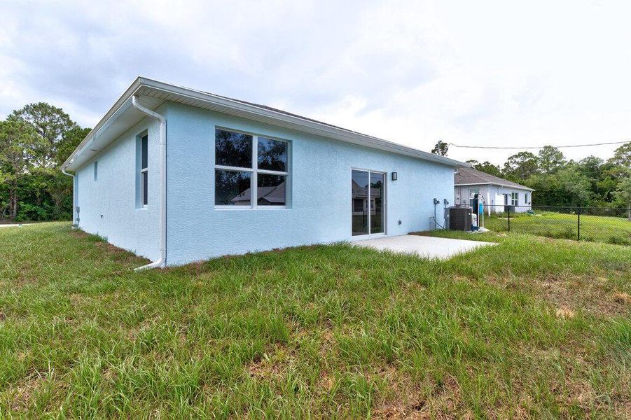 Front exterior of a new home in , Vero Beach, FL, highlighting curb appeal (Image 17). Front exterior of a new home in , Vero Beach, FL, highlighting curb appeal (Image 17).