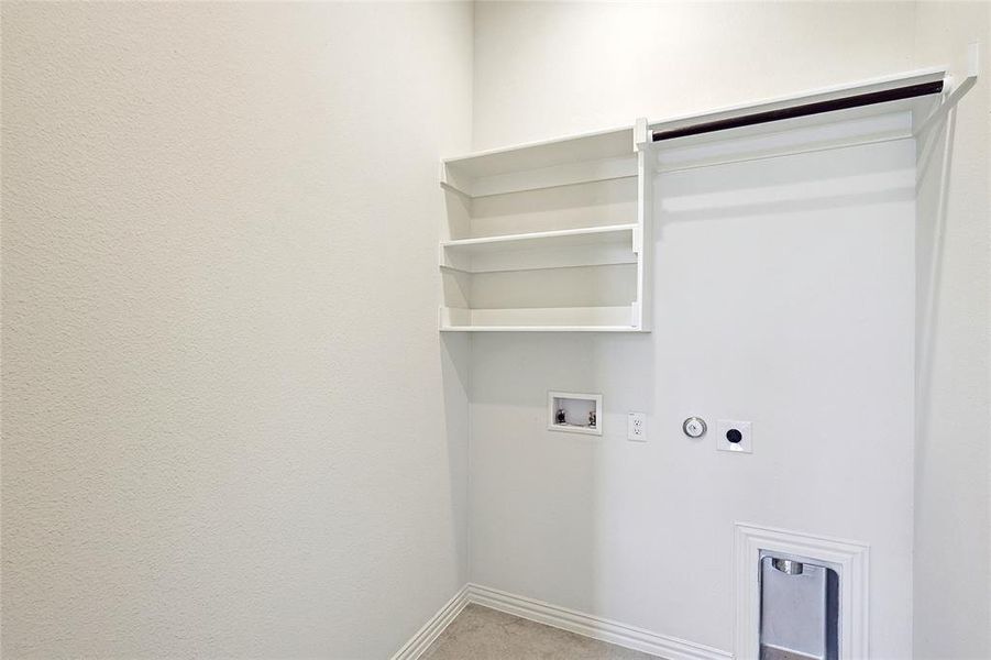 Laundry room featuring hookup for a washing machine and hookup for an electric dryer