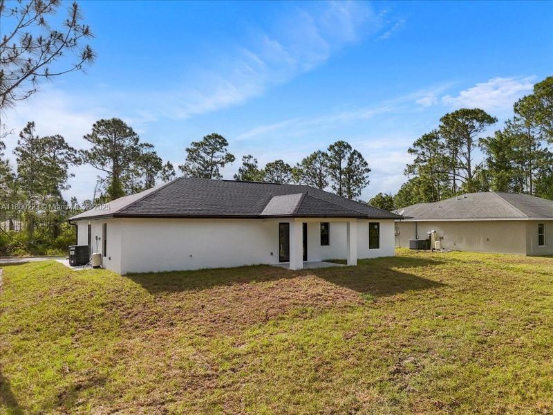 Exterior details and patio area of a home in , Lehigh Acres (Image 26). Exterior details and patio area of a home in , Lehigh Acres (Image 26).