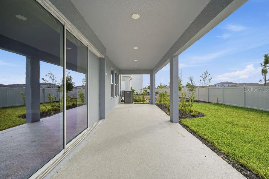 Exterior details and patio area of a home in Indigo Creek, Apollo Beach (Image 4).