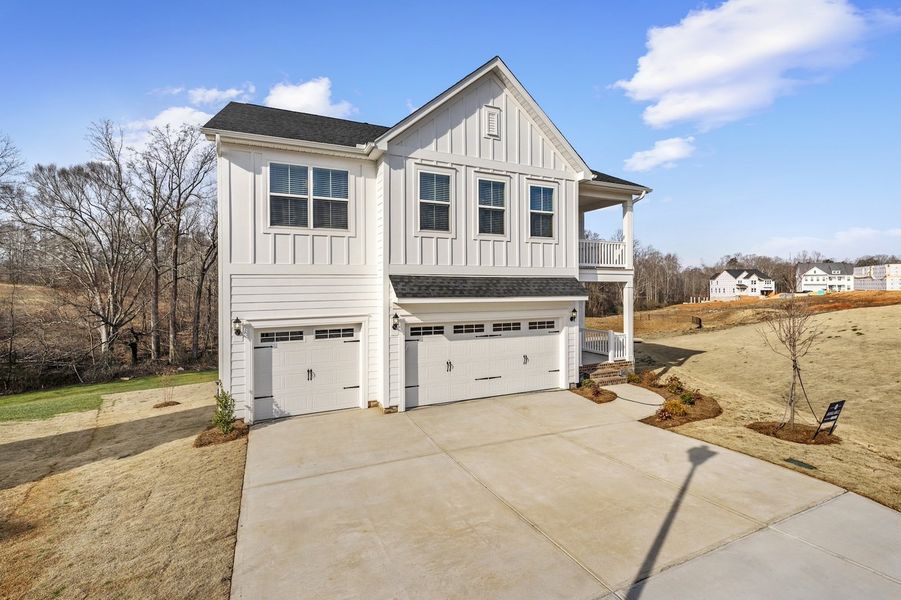 Front exterior of a new home in Parris Meadows, Chesnee, SC, highlighting curb appeal (Image 2). Front exterior of a new home in Parris Meadows, Chesnee, SC, highlighting curb appeal (Image 2).