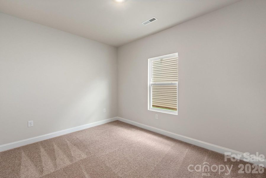 Spacious, unfurnished interior of a new home in Ascot Woods, Charlotte (Image 8).