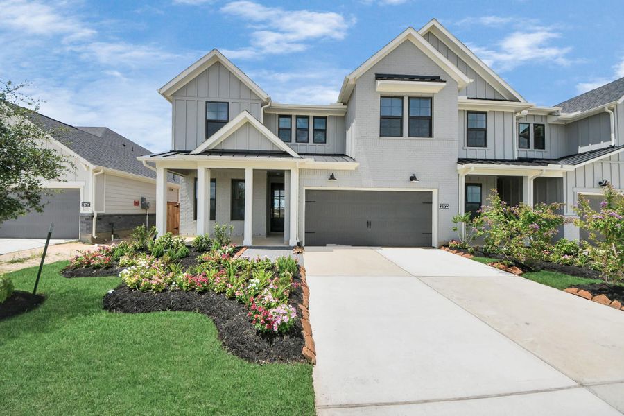 Front exterior of a new home in Bridgeland: Signature Collection, Cypress, TX, highlighting curb appeal (Image 17).