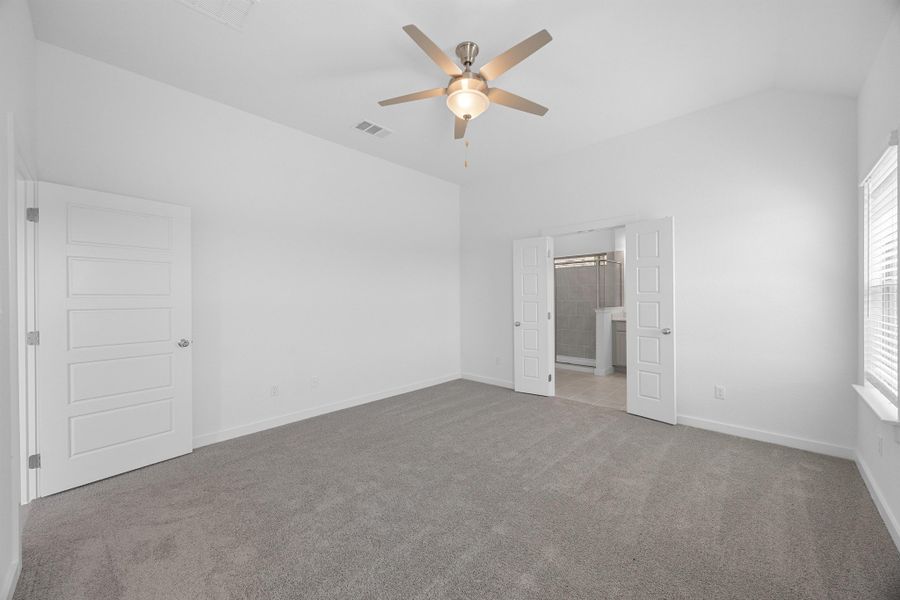 Primary Suite in the Pecan II home plan by Trophy Signature Homes – REPRESENTATIVE PHOTO