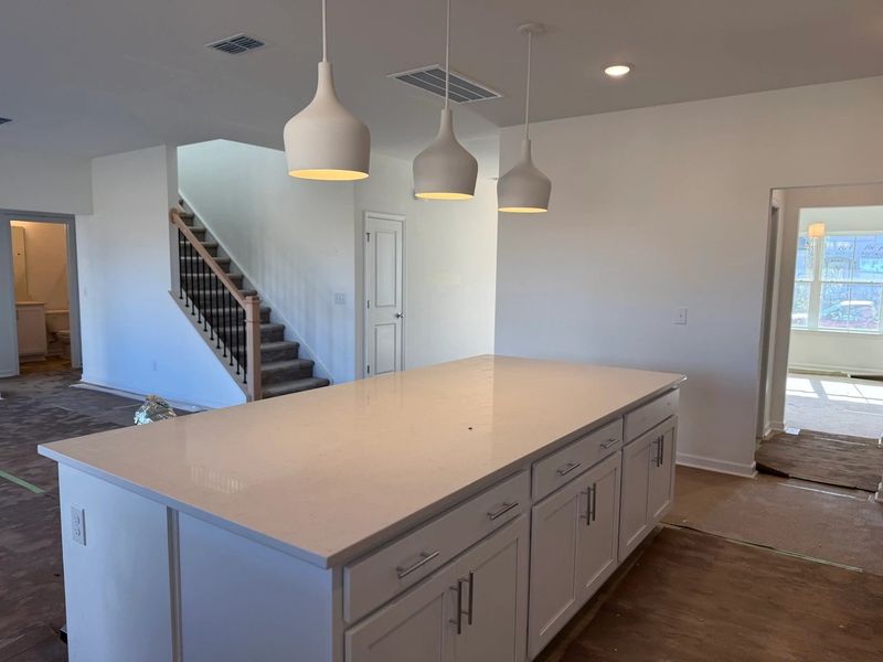 Kitchen featuring the AW Collection® Coastal - White cabinets and sea-glass tile backsplash.