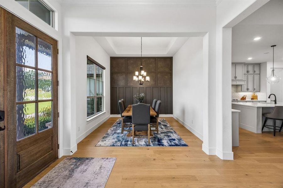 This formal living room is ready to elevate your guest greeting with its accent wall and great lighting.