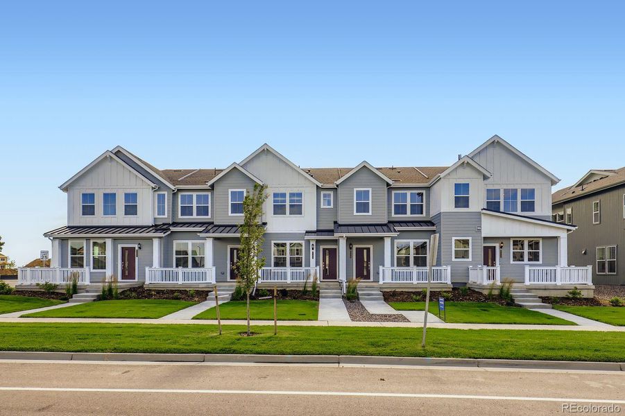 Front exterior of a new home in Sky Ranch: Parkside Collection, Watkins, CO, highlighting curb appeal (Image 1).